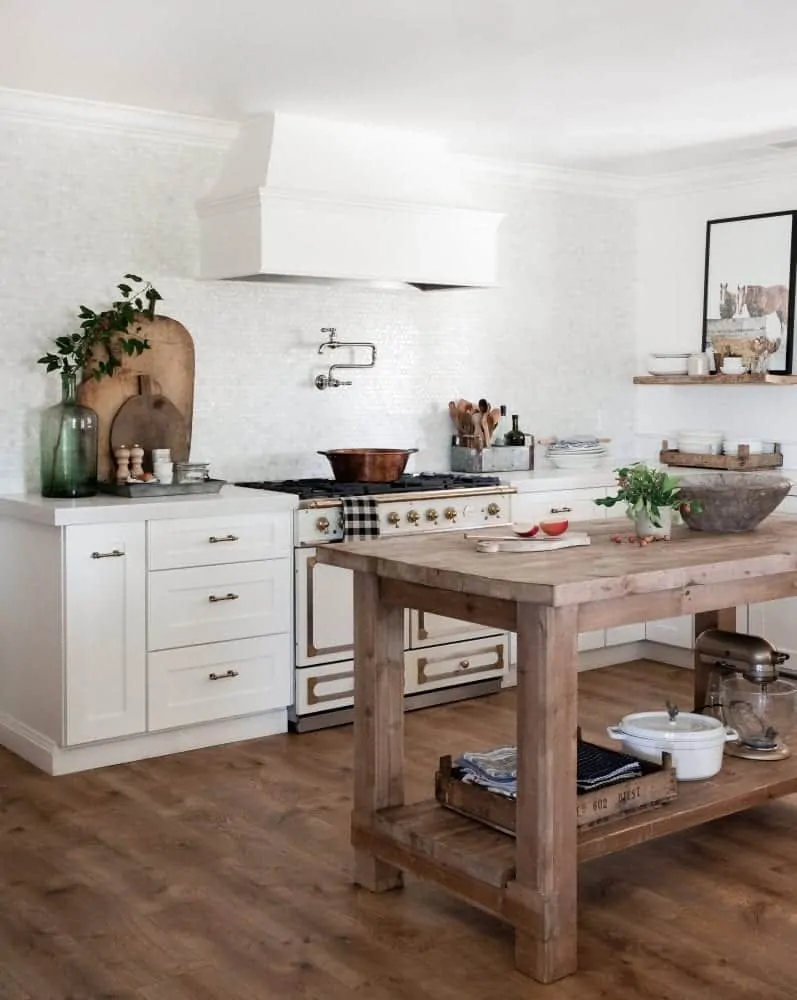 Farmhouse Kitchen with Wood Island and White Shaker Cabinets with White Concrete Countertops