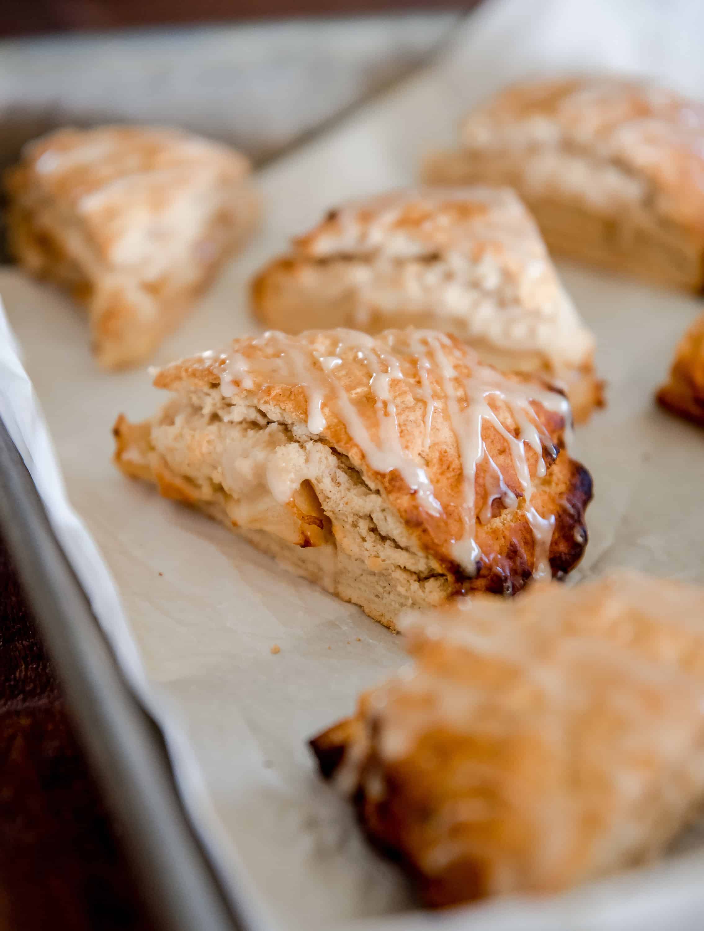 Looking for a delicious recipe for apple scones? You’ve come to the right place! These apple scones feature apple pie filling sandwiched between two layers of buttery dough!