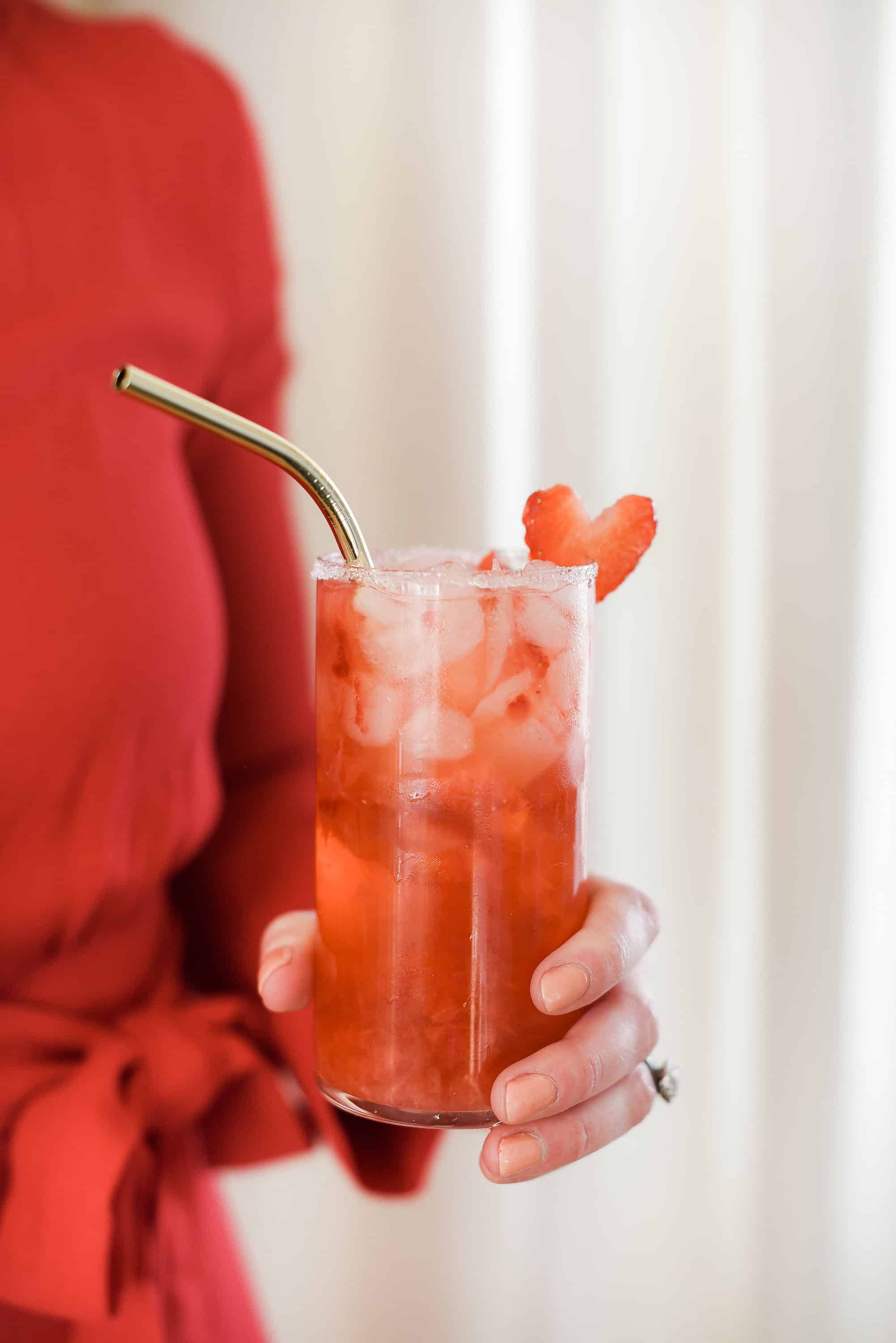 This strawberry champagne cocktail is the perfect thing to serve this Valentine’s Day! Made with crushed strawberries and rosé champagne, you will love this delicious cocktail for Valentine’s Day!