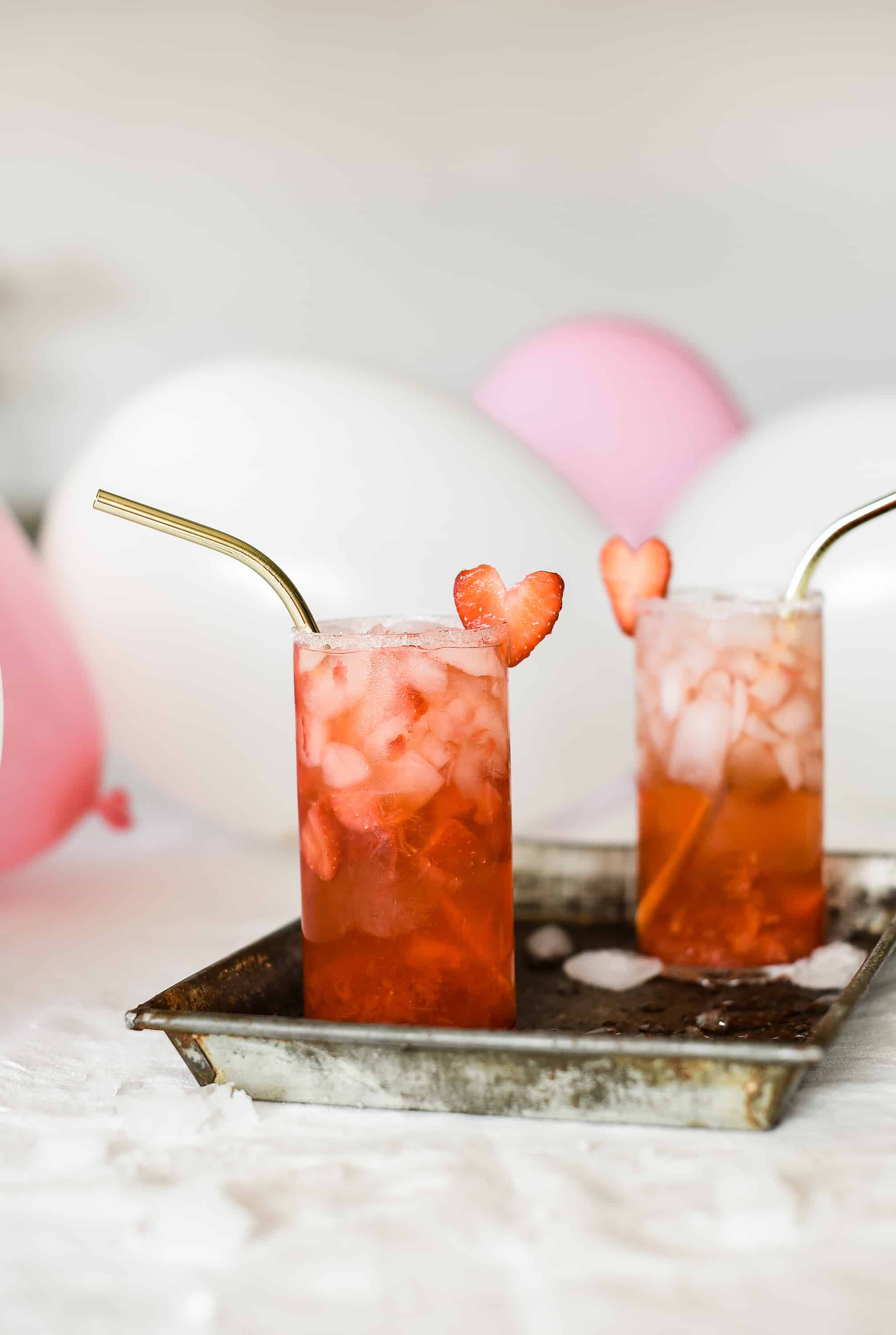 This strawberry champagne cocktail is the perfect thing to serve this Valentine’s Day! Made with crushed strawberries and rosé champagne, you will love this delicious cocktail for Valentine’s Day!