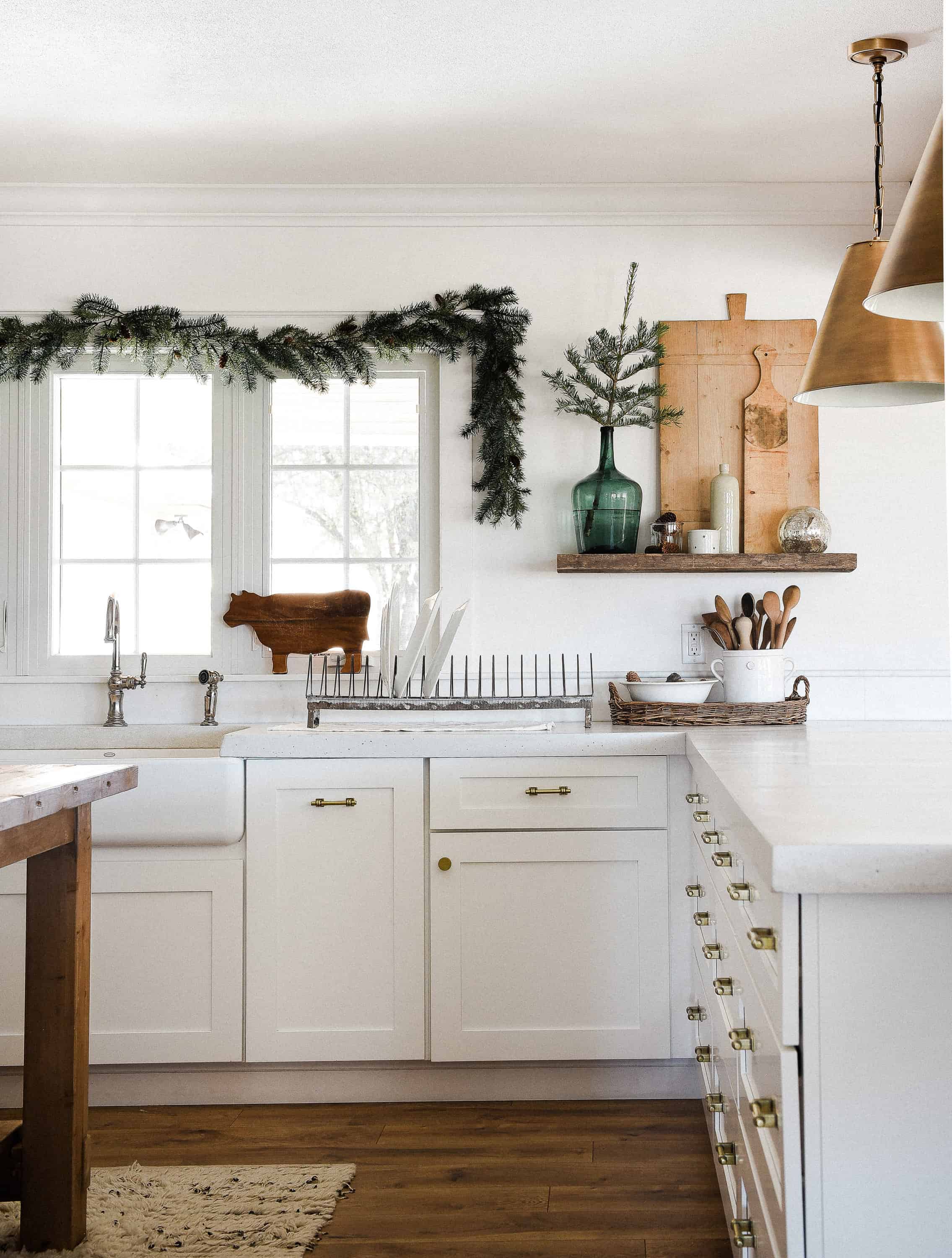 Tour our Christmas kitchen to gather ideas for decorating for the holidays this year! Use greenery and vintage touches to keep things simple and cohesive!