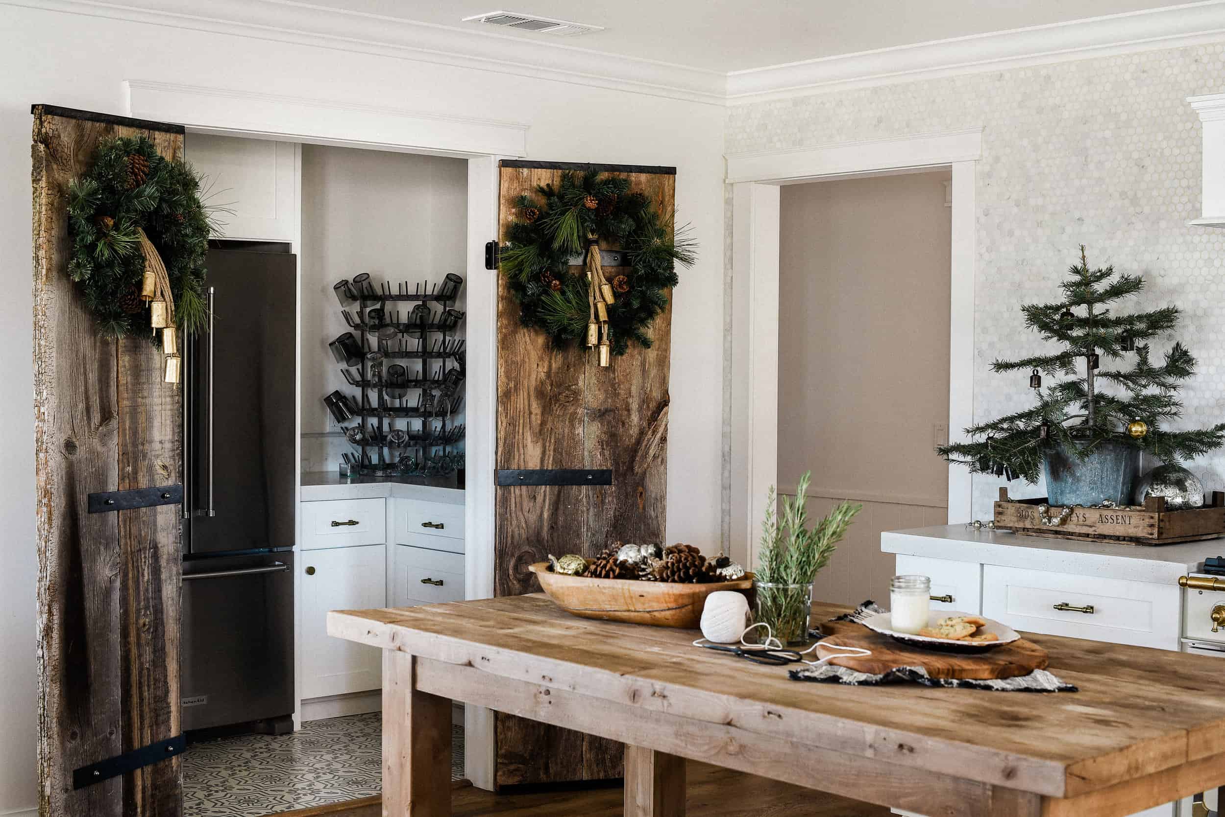 Tour our Christmas kitchen to gather ideas for decorating for the holidays this year! Use greenery and vintage touches to keep things simple and cohesive!