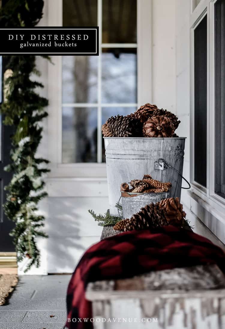 Create your own distressed galvanized buckets with toilet bowl cleaner and sand paper! The perfect home for Christmas trees, pine cones, and holiday decor!