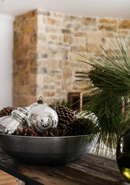 Mercury glass and greenery are the perfect touches for a simple farmhouse Christmas.