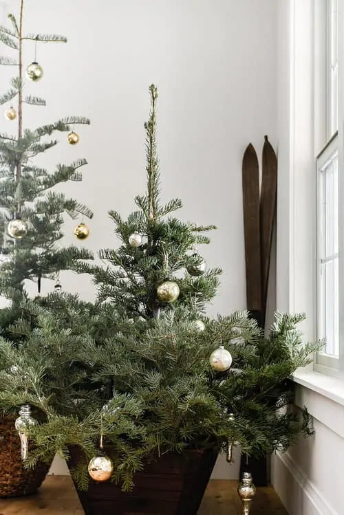 Mercury glass and greenery are the perfect touches for a simple farmhouse Christmas.