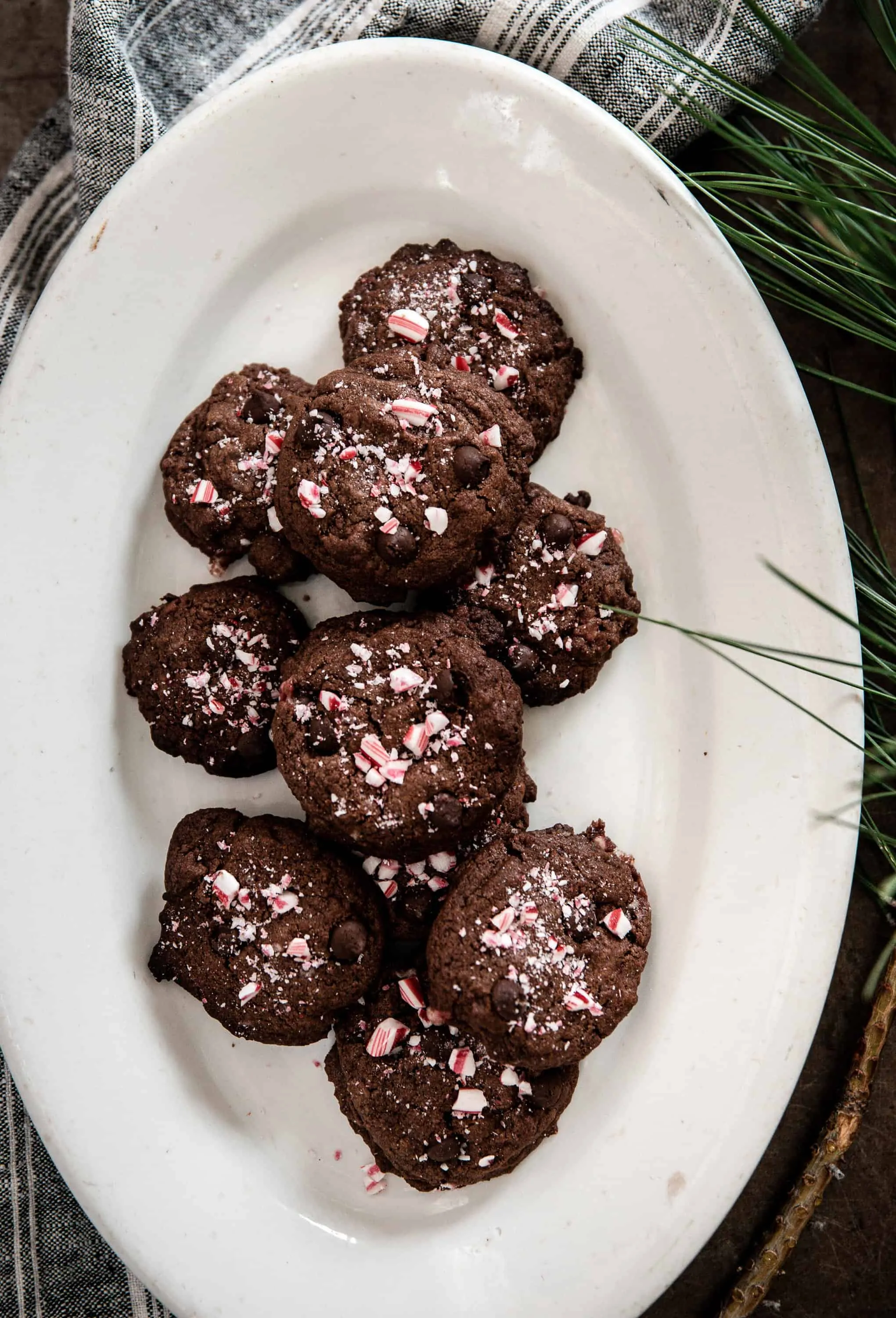 Chewy and delicious chocolate peppermint cookies are packed with cocoa powder, chocolate chips, peppermint extract, and crushed candy cane! There’s a burst of Christmas flavor in every bite!