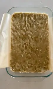 Pretzel bar dough pressed into glass baking dish