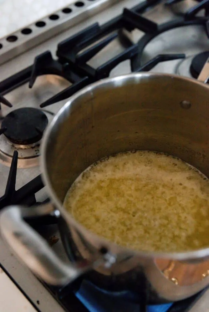 Butter & sugar melting in large pot for caramel sauce