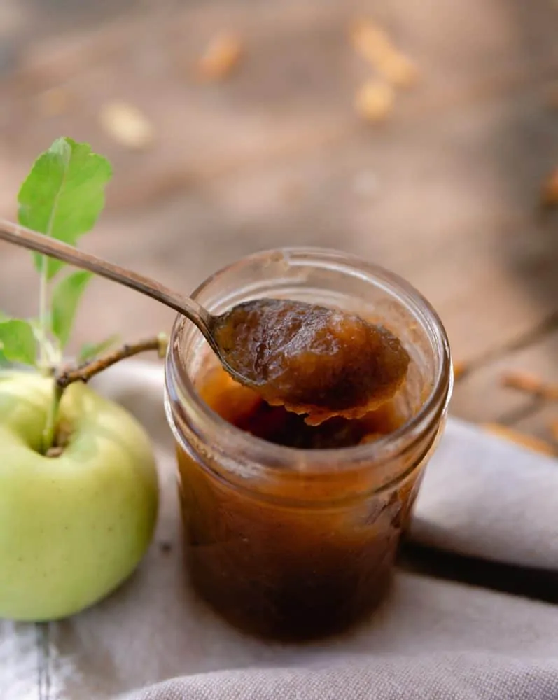 Jar of apple butter on table