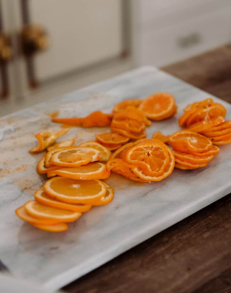 slide oranges on marble cutting board for orange marmalade