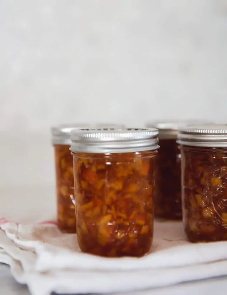 jars of orange marmalade on countertop