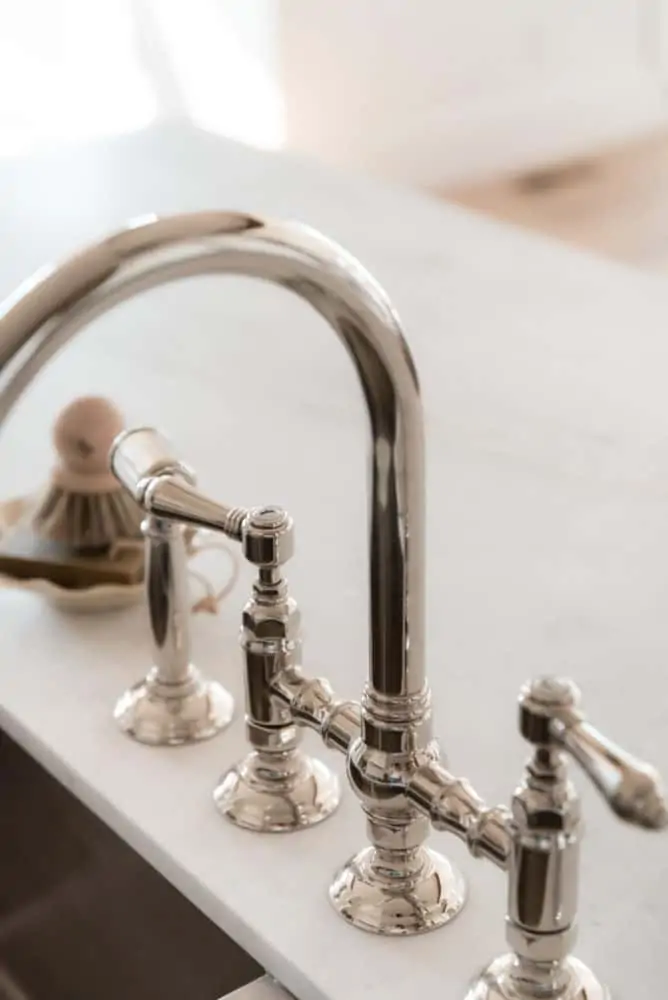 Beautiful Rohl kitchen sink faucet in polished nickel by Boxwood Avenue Interiors.