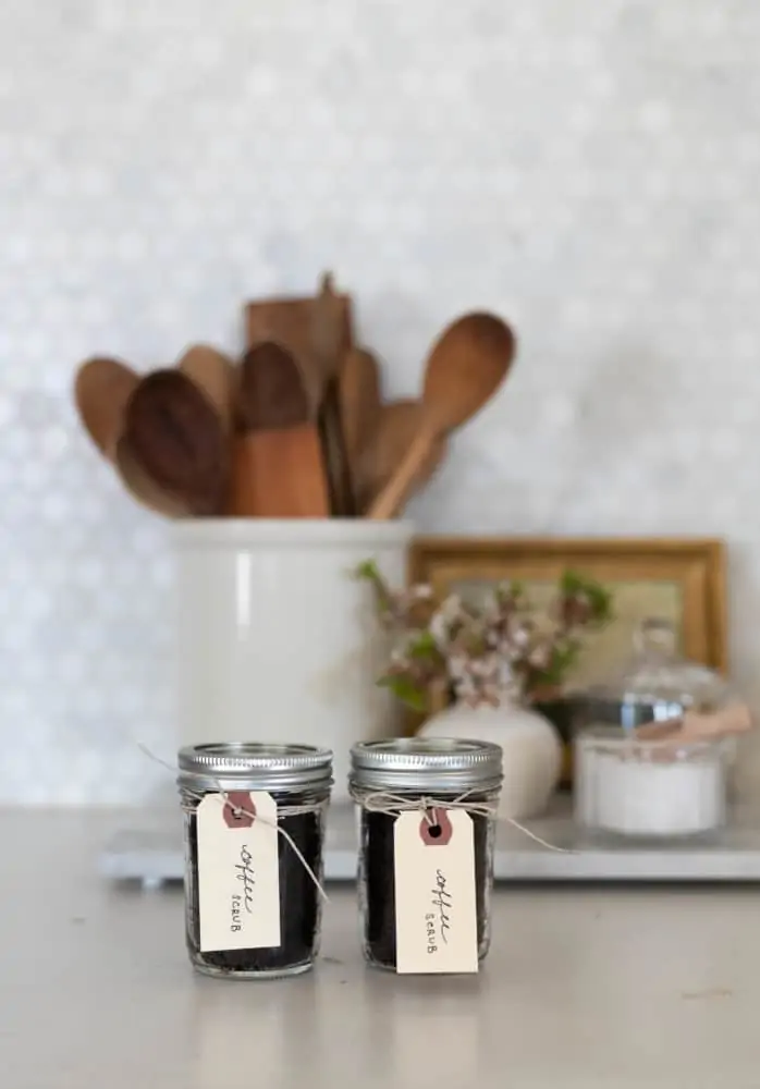 2 jars of DIY Coconut Coffee Scrub sitting on counter.
