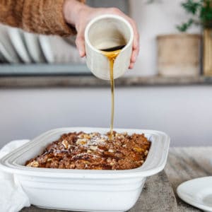Maple syrup poured on to baked french toast with streusel topping.