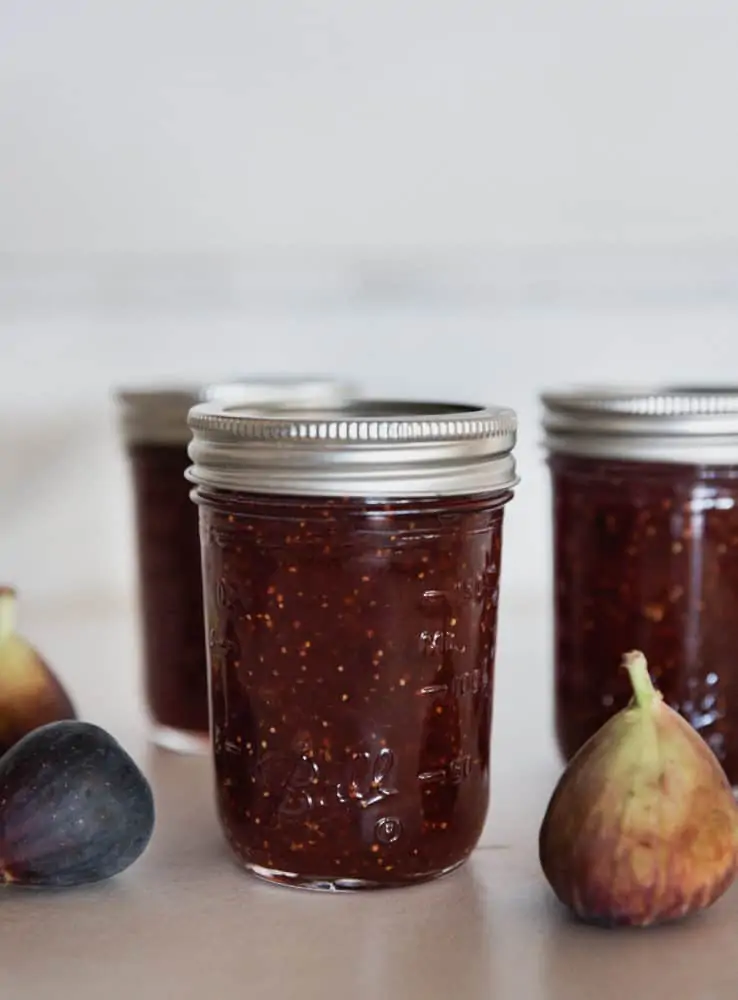 Three mason jars of canned fig jam.