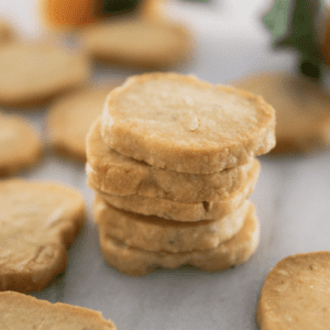 Stack of Orange Shortbread Cookies on Marble Countertop