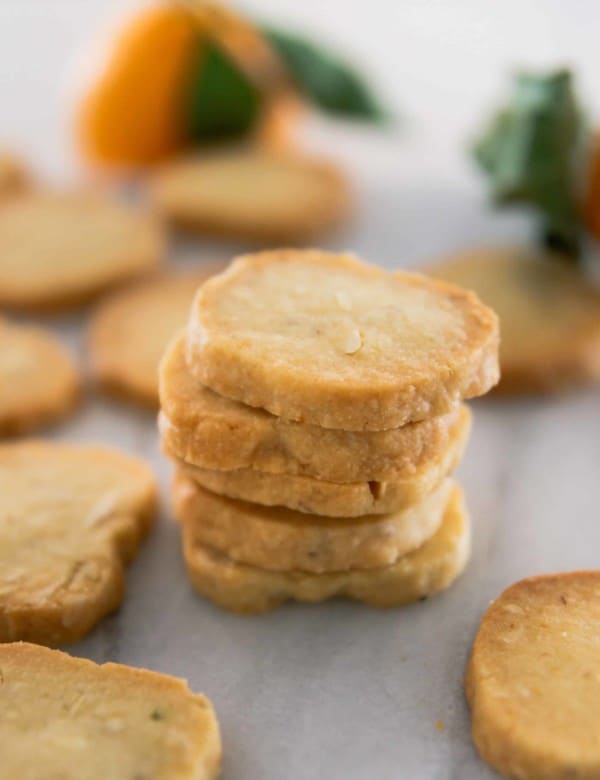Stack of Orange Shortbread Cookies on Marble Countertop
