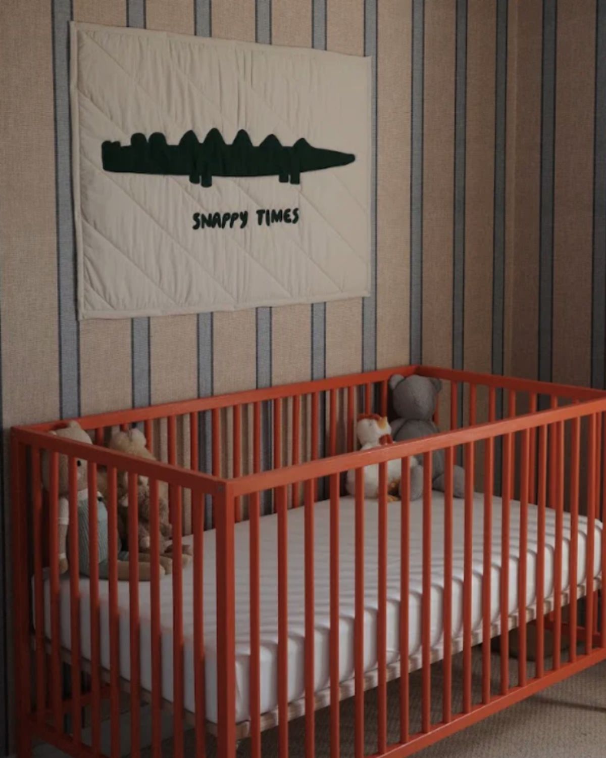 Boys Nursery with crib and wall paper