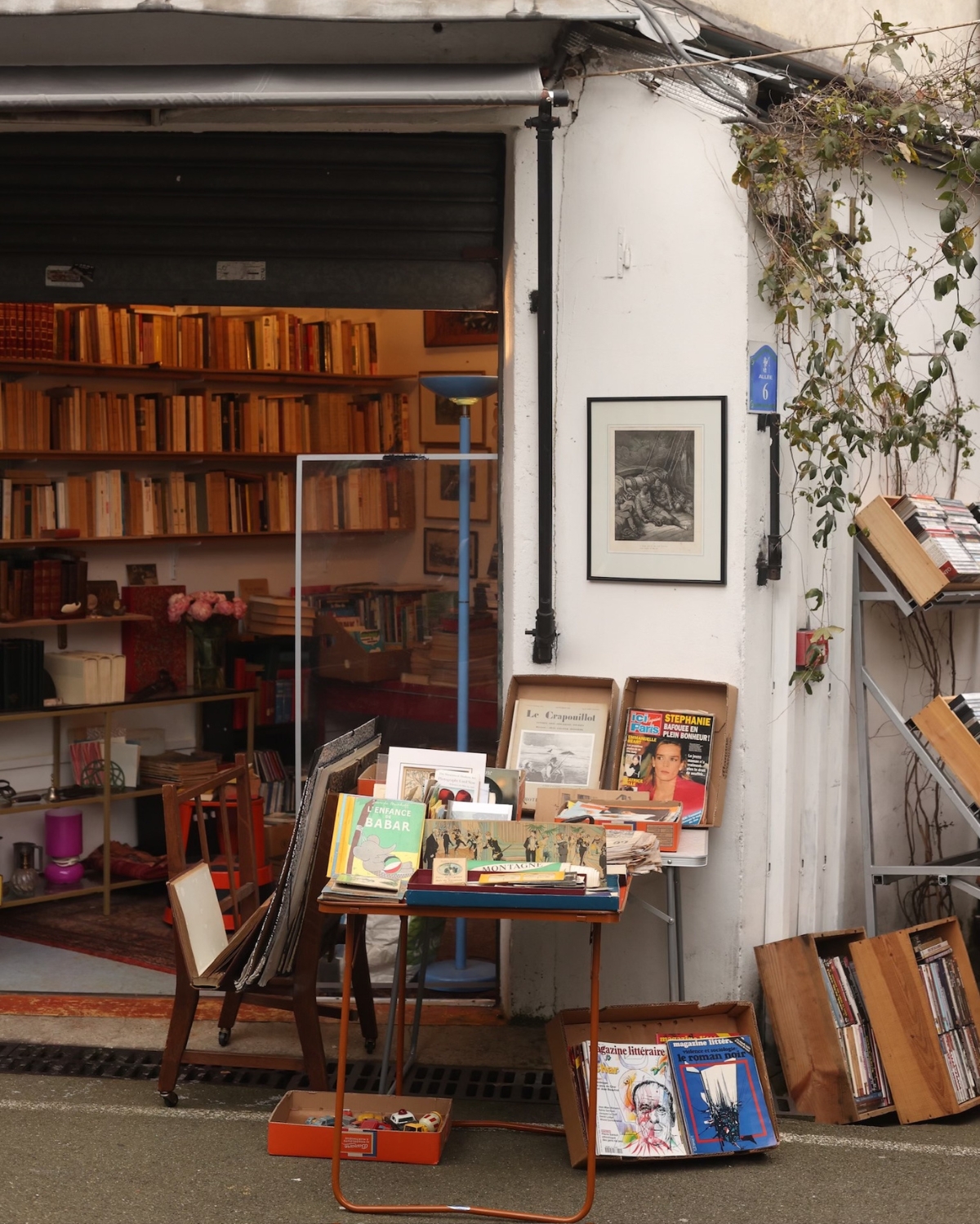 A display of one-of-a-kind vintage pieces at a Paris flea market, featuring unique antiques such as ornate furniture, rare artwork, and distinctive collectibles that tell a story of the past.