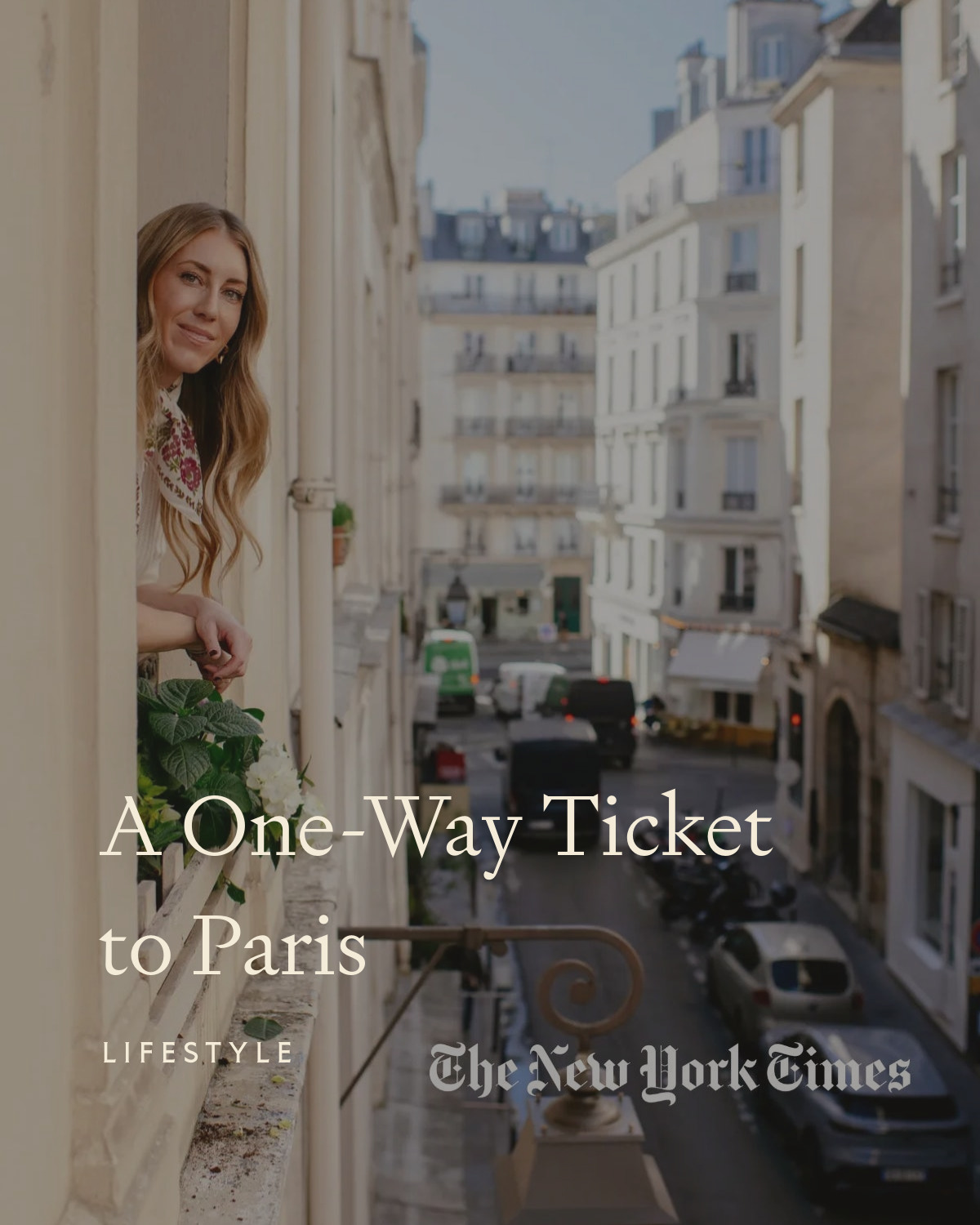 girl leaning out the window overlooking a street in Paris